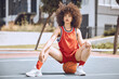 Basketball player with funky, confident and cool attitude ready for competition, game or fit training match on a sports court. Beautiful black woman, healthy athlete and motivation female with afro
