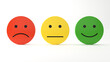 Plastic smiley faces to express sad, neutral and happy feedback