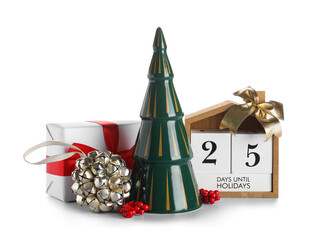 Composition with ceramic Christmas tree, calendar, gift box and decorations on white background