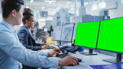Leinwandbilder - Factory Office: Industrial Engineers Drafting Equipment 3D Layouts of a Heavy Industry Machine Parts on a Computer CAD Software. One Computer Monitor Display is a Green Screen Mock Up Template.