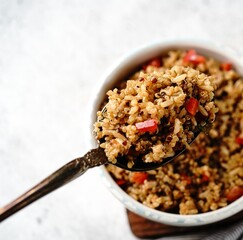 Wall Mural - Quinoa brown rice pulao with red pepper served in a bowl- healthy eating concept