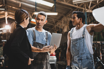 professional male technician mechanic man working to repair maintenance automobile at auto car garage service, talking with vehicle owner client about workshop job, automotive engine business shop