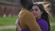 © Marco - Interracial couple hugging each other outside. Young modern millennial relationship embrace