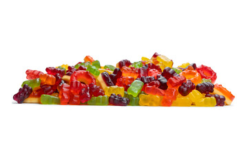 Sticker - Assorted colorful gummy candies. Top view. Jelly donuts. Jelly bears. Isolated on a white background.