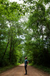 © Tandem Stock - Photographer Ian Shive observes the canopy over the Ghost Road Scenic Drive, Big Thicket National Preserve, Texas.