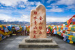 Monument and prayer flags on Pang La Pass. Tibet Autonomous Region. China.