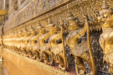 Wall Mural - Garuda statues around emerald buddha temple at Wat Phra Kaew in Grand Palace in Bangkok Thailand