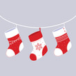 Christmas socks hanging on a rope. Red Christmas sock for winter holiday. Home decoration. Vector illustration flat design.