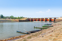 Local Fishery, Yasothorn Dam, Phanomphai Dam, Fisherman Boats Floating On Dam Background, Local Fishing, Flood Gate Dam Open For Agriculture, Boats In The River, Local Fisherman Village Thailand.
