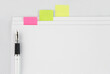 © korey - Pen on the stack of documents with colorful sticky notes