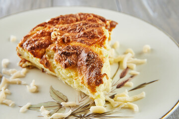 Wall Mural - Potato, zucchini, cauliflower and yellow cheese souffle on plate