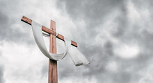 Christian Cross On Grey Cloudy Sky Background Announces Jesus's Rising From The Dead.