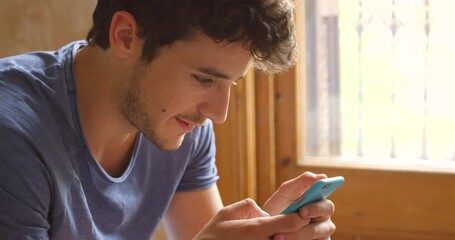 home, phone and young man typing social media app message, blog post or contact social network user.