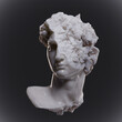 Illustration from 3D rendering of classical style broken male head sculpture isolated on black background.