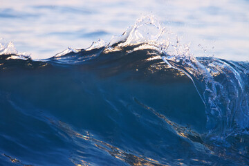 Blue color ocean wave closeup. Blue wave water.