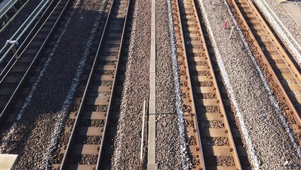 Canvas Print - top down view over to the japan track railway with train running moving passing , japan modern public transportation