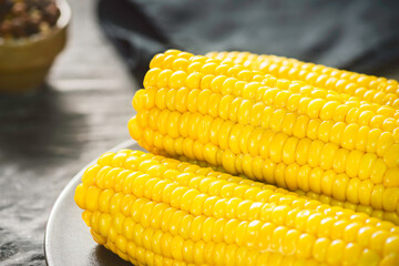 Wall Mural - Delicious corn on the cob with melted butter. Close up with copy space. 