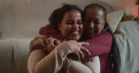 Wall Mural - Mother and daughter having tender moment after fitness exercises at home - Family and sport concept in winter time