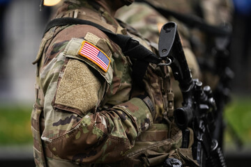 us army soldiers uniform. close up photo with the united states of america flag on a military soldie