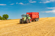 © Wolfgang Jargstorff - Tractor with loader wagon during grain harvest in the cornfield