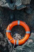 Lifebuoy Placed On Rocky Formation