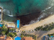 Resort with swimming pool on the Sal Island coast in Cape Verde from the drone during sunset