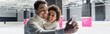 © LIGHTFIELD STUDIOS - Cheerful man taking selfie with african american girlfriend on ice rink, banner