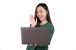 © Parichat - Portrait of an excited young asian girl holding laptop computer and celebrating success isolated over white background.