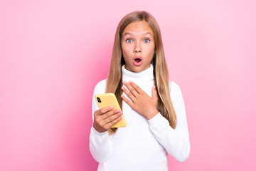 Wall Mural - Photo of astonished impressed girl hand touch breast herself win gadget unbelievable really seriously me isolated on pink color background