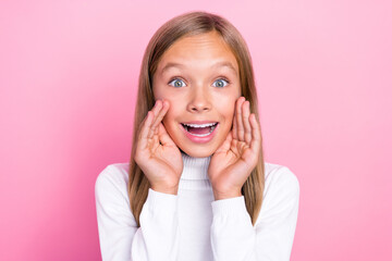 Poster - Portrait of positive astonished person arm near mouth say tell toothy smile isolated on pink color background