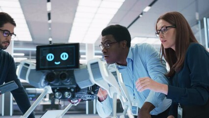 Poster - Close Up Portrait of a Young Diverse Group of Engineers Use Computers, Connect Microchips, Analyze and Discuss How a Futuristic Robot Dog Works. High Tech Research Laboratory with Modern Equipment.