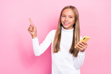 Sticker - Photo of satisfied girl stylish clothes hand index empty space recommend device gadget shop nice sale isolated on pink color background