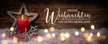 Christmas Greeting Card With German Text Frohe Weihnachten Und Ein Gutes Neues Jahr. Merry Christmas And Happy New Year. Panorama, Banner. Christmas Candle In Winter Snow Landscape.