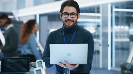 Aufkleber - Handsome Hispanic Man Wearing Glasses Smiling and Looking at Camera. Young Intelligent Multiethnic Male Engineer, Developer or Scientist Working in Development Technology Office.