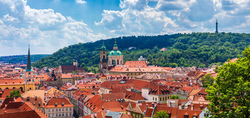 Wall Mural - Top view to red roofs skyline of Prague city, Czech Republic. Aerial view of Prague city with terracotta roof tiles, Prague, Czechia. Old Town architecture with terracotta roofs in Prague.