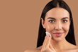 © Prostock-studio - Closeup of pretty young woman using peeling cotton pad