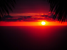 A Perfect Sunset With Natural Light Rays Over The Pacific Ocean,