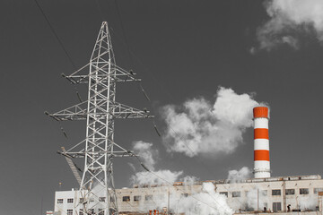 Wall Mural - The pipe of the industrial plant emits toxic grey smoke into the atmosphere sky and air. Pollution of the environment and ecology. Thermal power plant power lines high voltage