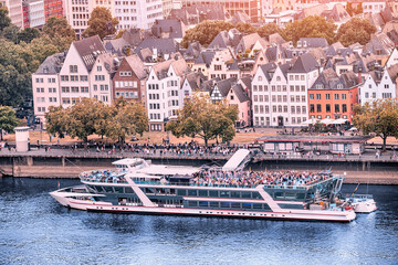 Poster - Koln - Dusseldorf cruise ship transports tourists and passengers on deck and in comfortable cabins by Rhine river