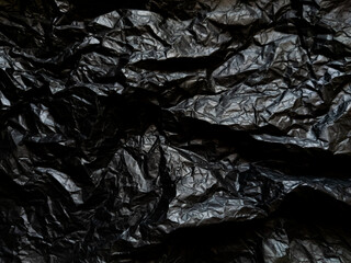 Wall Mural - Crumpled black paper with texture. Dark black textured background