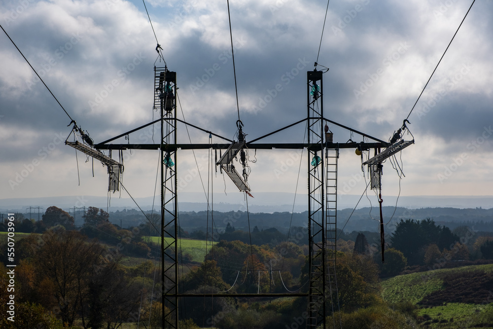 Distribution Line Modernization High voltage transmission tower, power line modernization, high-rise ...