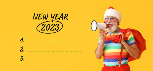 Canvas Print - Santa Claus with megaphone and blank to-do list for year 2023 on yellow background