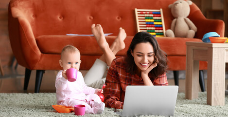 Poster - Working mother with her baby at home