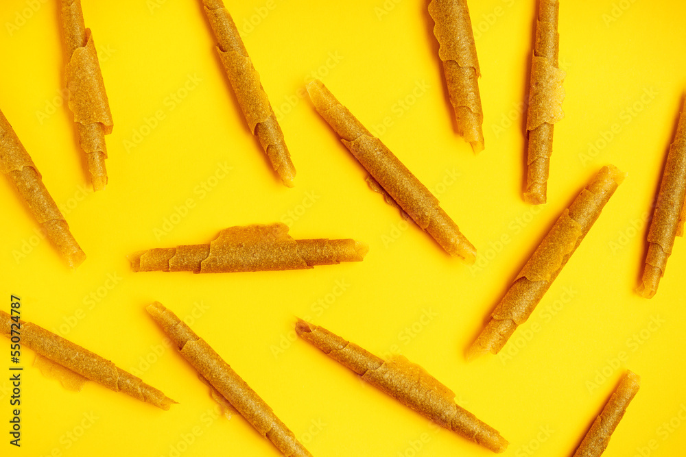 Tasty apple pastilles on color background