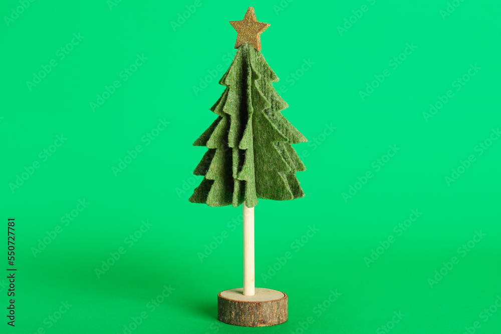 Felt Christmas tree on green background