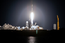 SpaceX Rocket Falcon 9 Rocket  Capsule Soars Upward After Lifting Off From Launch Pad. Digitally Enhanced. Elements Of This Image Furnished By NASA.