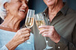 © Anela/peopleimages.com - Champagne, love and senior couple toast for marriage anniversary date, partnership or retirement health. Romance, glass alcohol drinks and elderly people smile, bond and cheers at celebration event