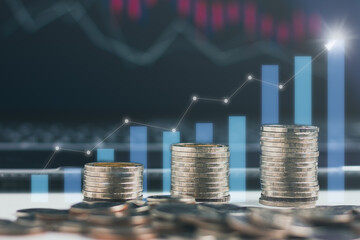 Stack of coin with trading graph, financial investment concept.