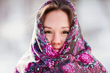 Close-up Portrait Of A Young Woman In A Beautiful Ethnic Shawl In Winter