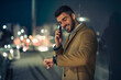© ivanko80 - Portrait of smiling businessman at night
